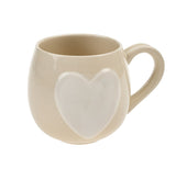 Tasse crème avec cœur blanc